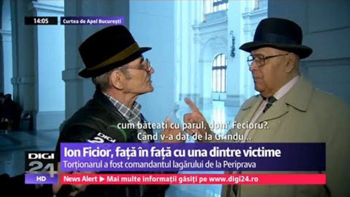 Ion Ficior (dreapta), luat la întrebări de una dintre cei ce au avut de suferit în penitenciarul de la Periprava. Captura Digi24
